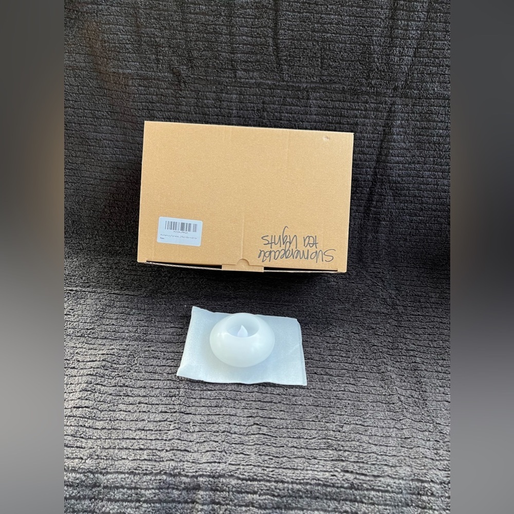 Set of 12 Homemory immersible tea lights.​